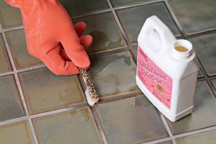 Use gloves and goggles when you acid wash the area. A small brush helps you agitate the solution into the joints.