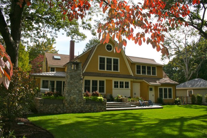 Fall trees and lawn in front of a house