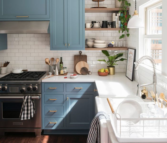 Metallic pulls on a blue kitchen cabinets