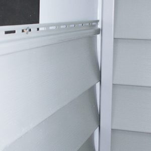 slip each siding panel behind the J-channel