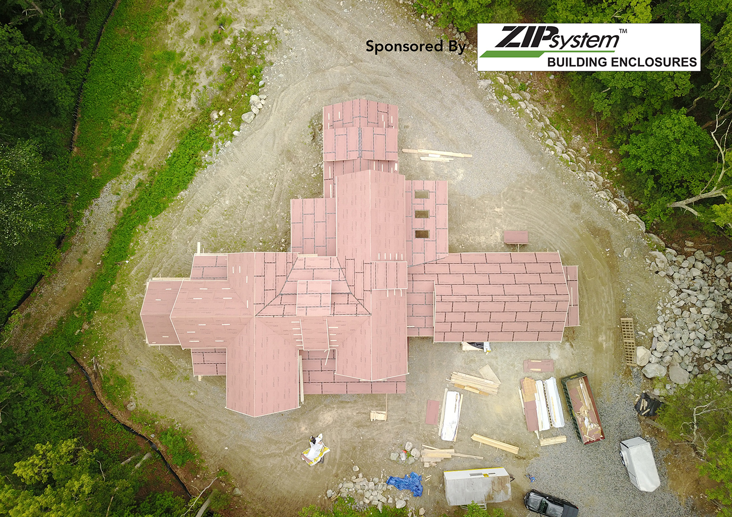Aerial view of a large house with the ZIP System logo in the corner