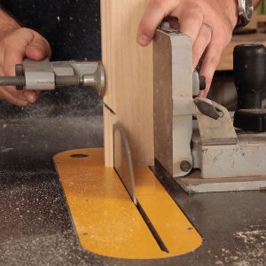 With the blade tilted at 45°, cut the miter on the stiles equal to the depth of the profile.