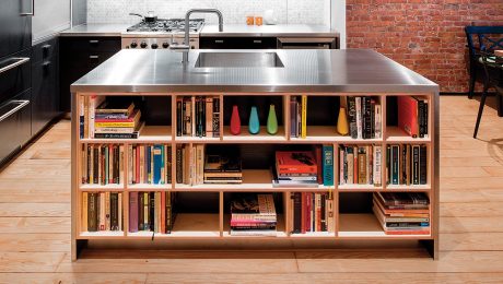 Stainless steel kitchen countertops with books underneath