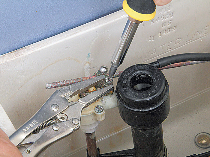 adjustment screw at the valve