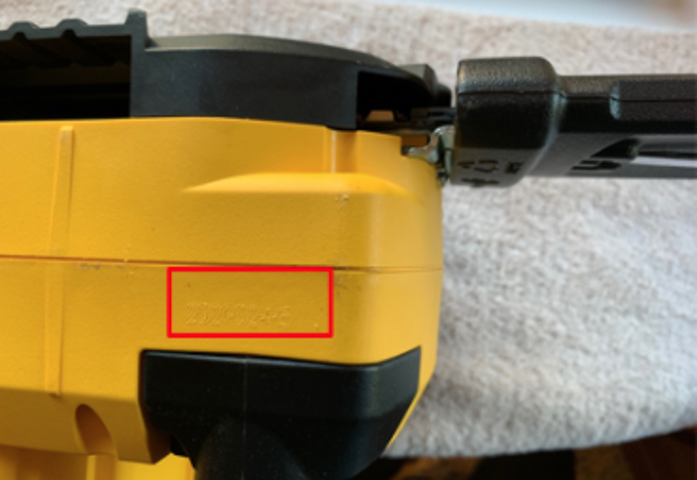 Photo of the date stamp on DeWalt's recalled chainsaws.