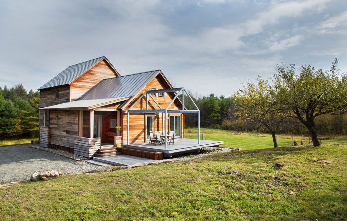 A side view of the house with an outdoor patio