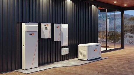 A wall with Generac solar storage boxes against it