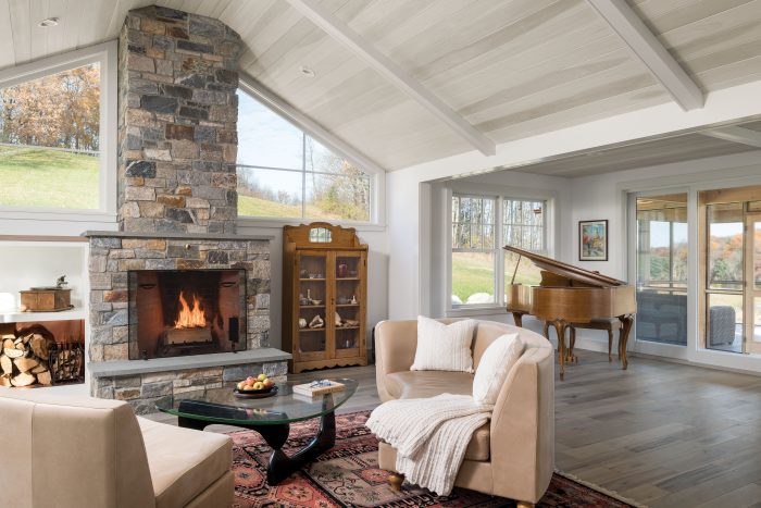 Living room with a stone fireplace