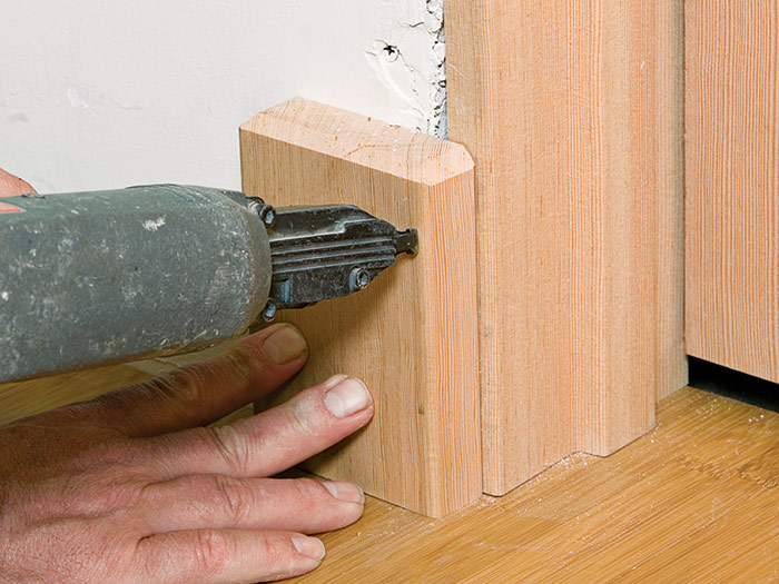 Nail plinth block to jamb and door framing