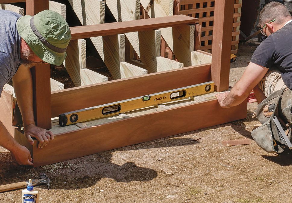 Account for out-of-level. For the bottom riser, a tapered cut was necessary to adjust for the uneven patio. A measurement taken on both sides of the riser determines the taper.