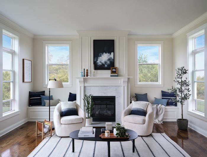 A living room surrounded by windows