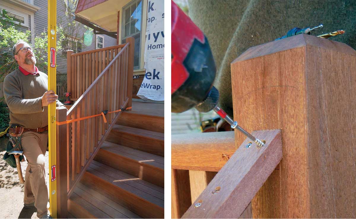 Set the railing section on the bottom rail, using a ratchet strap to hold it in place while you check for plumb. Secure the section from underneath with screws through the bottom rail, and then secure the top subrail with two screws into each post.