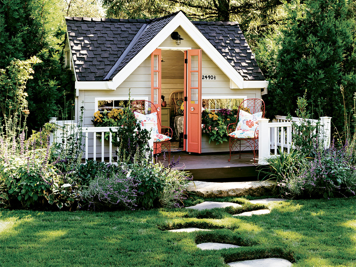small garden shed with bright orange door