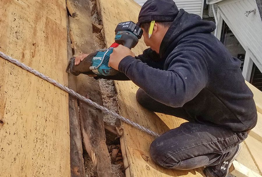 Cutting through the existing roof sheathing