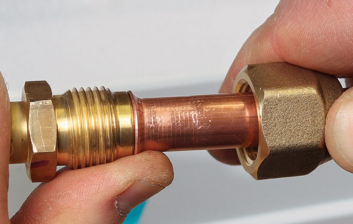 Align the copper flare with the brass flare cone
