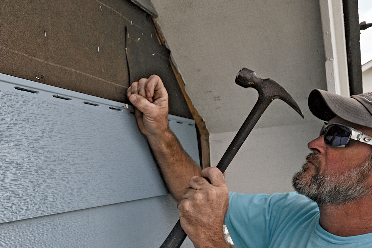 securing PVC siding with stainless-steel roofing nails