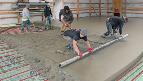 smoothing out the concrete for the heated slab