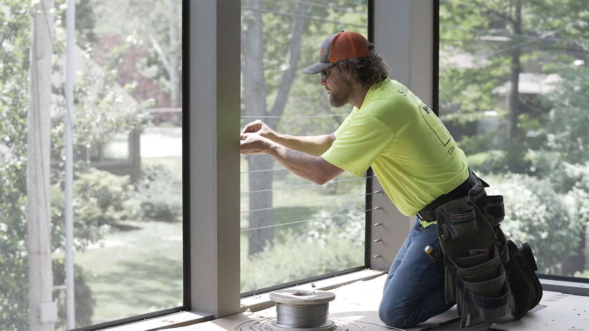 Installing a screened-porch cable rail system
