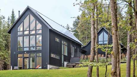 gray compact home with large windows