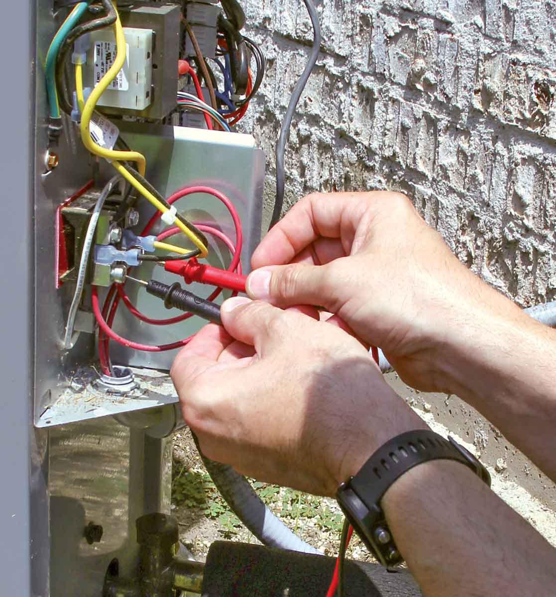 use the test leads on a multimeter to measure the voltage on both legs supplying the terminal block on the outdoor unit