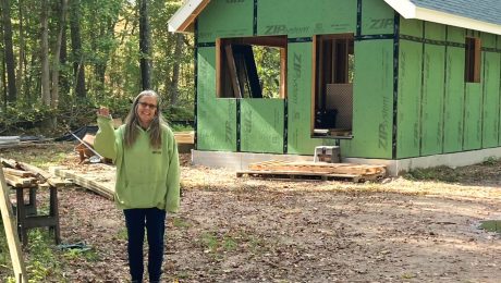 Photo of Kerri standing in front of her home with ZIP sheathing
