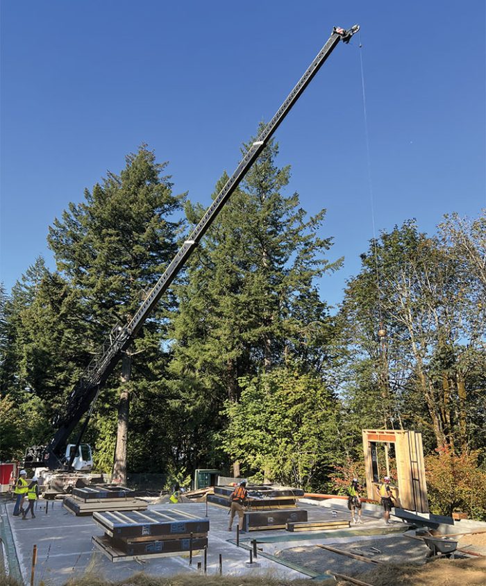 Panels being placed with a crane