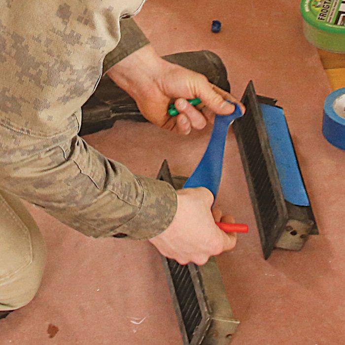 Photo of hands removing and labeling registers.