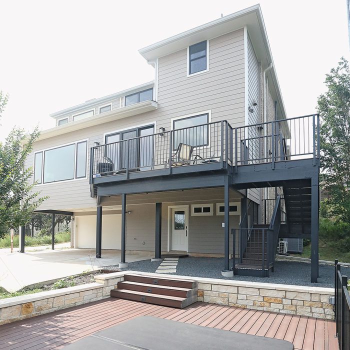 Photo of a back deck addition built using noncombustible materials like brick and fiber-cement siding.