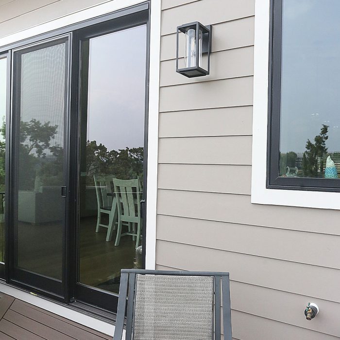 Photo of the back deck addition built using noncombustible materials like brick. steel, and fiber-cement siding.